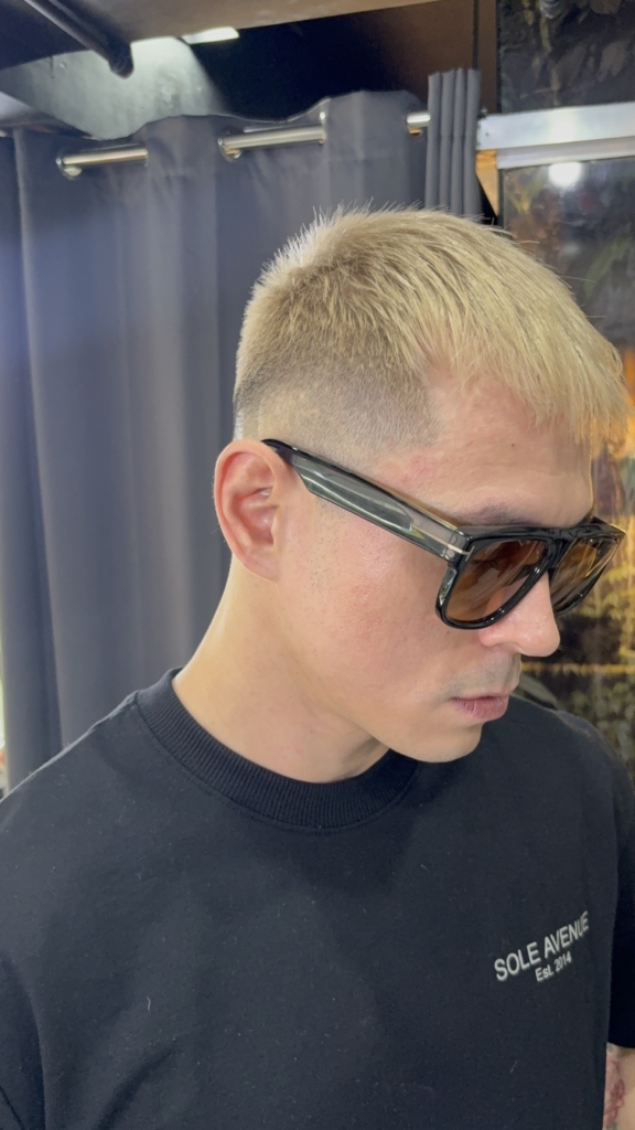 Side view of Jake Cuenca’s short blonde hair and faded haircut