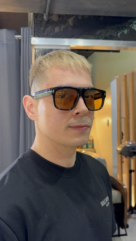Jake Cuenca wearing sunglasses with his finished short blonde hair